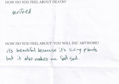 photo taken of part of a 'death feeback' form with three typed questions and handwriting answers in green pen.